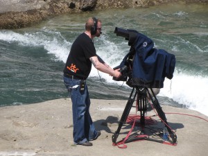 A Hit the Roof cameraman in position to capture the canoeing action.