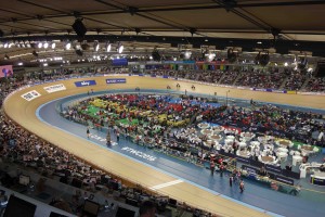 Inside the velodrome, looking towards track centre packed with riders, hospitality area and Media Mixed Zone personnel
