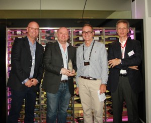(L to R) SVG Editorial Director Ken Kerschbaumer, outgoing chairman Peter Angell, incoming chairman David Shield, and Canon Europe's Luca Rocca, at the Sport Production Awards 2016. (Image: Tim Frost)