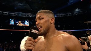 Anthony Joshua talks to the fans using the Sky Sports Box Office microphone after his victory over Wladimir Klitschko in Wembley