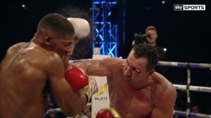 Klitschko connects during the fight with Joshua, with a Sky Sports’ cameraman in the background.